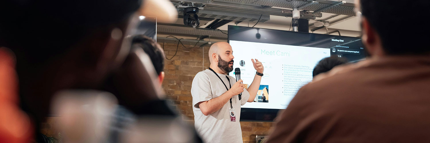 Speaker talking with a presentation