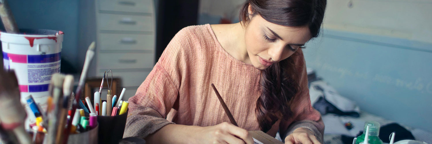 woman writing on a package label